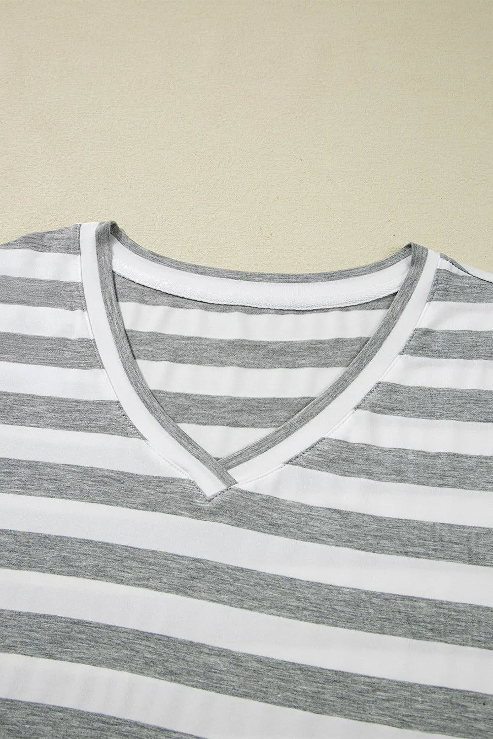 Casual Striped V-Neck Midi T-Shirt Dress neckline detail with gray and white stripes.