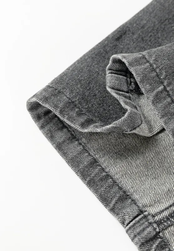 Wide Strap Button Down Denim Overall Dress close-up view of fabric detailing and stitching