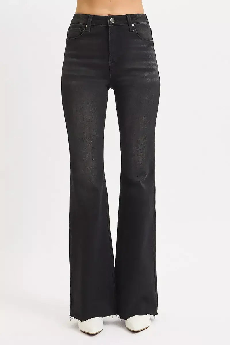 RISEN full size high rise flare jeans with raw cut hem for plus size, featuring a sleek black finish.