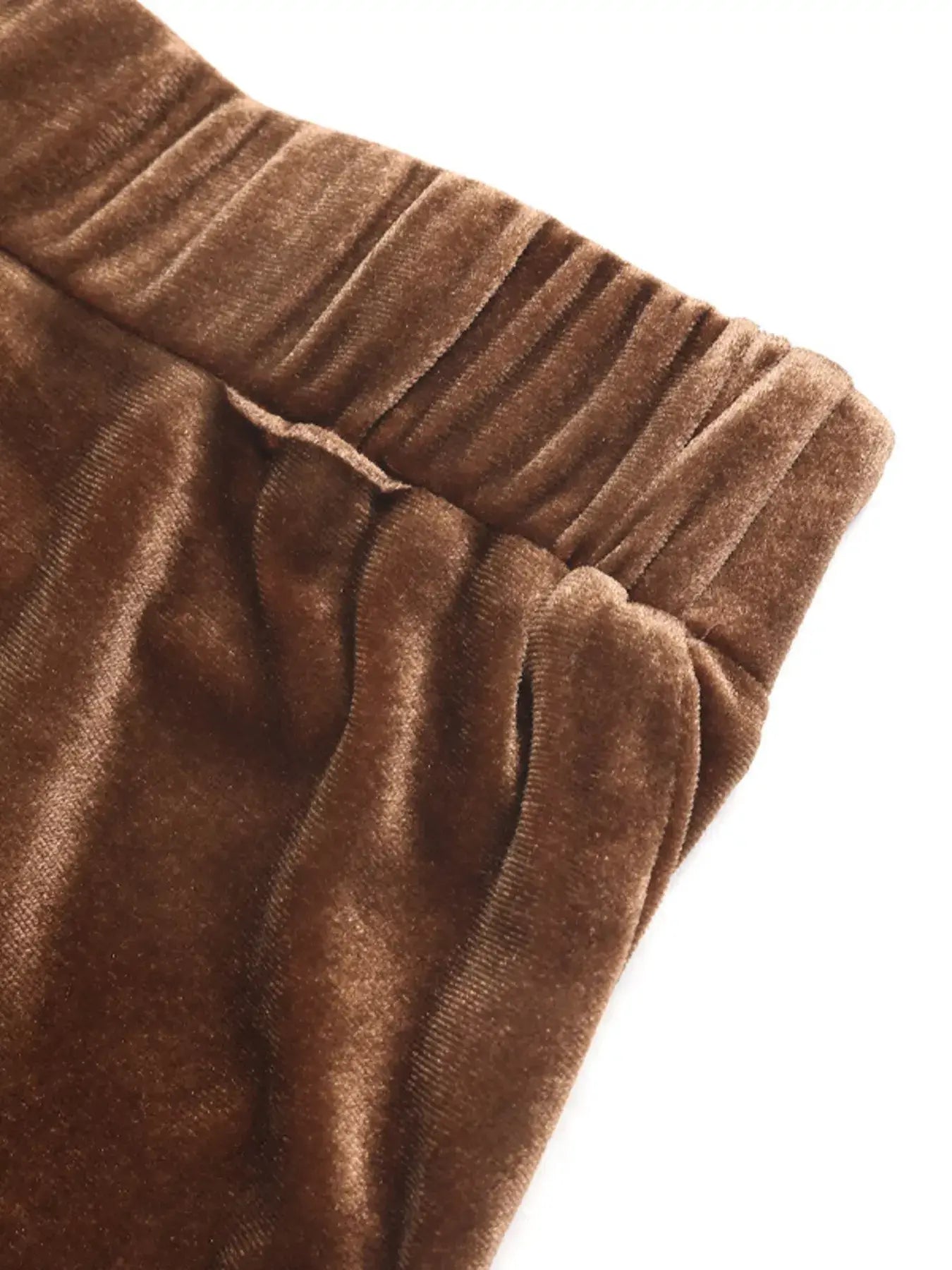 Close-up of the waistband of the Velvet Tiered Midi Skirt showcasing soft velvet and ruched design.