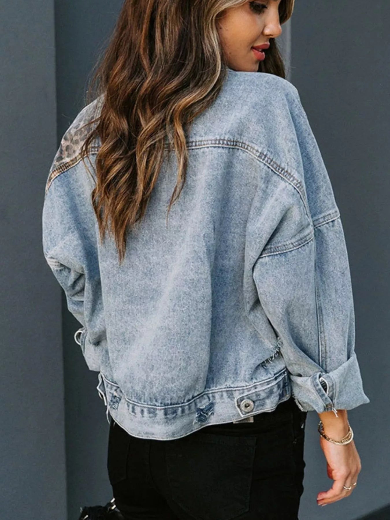 Leopard Print Patchwork Denim Jacket trendy street style showing back view with detailed stitching and buttoned sleeves.