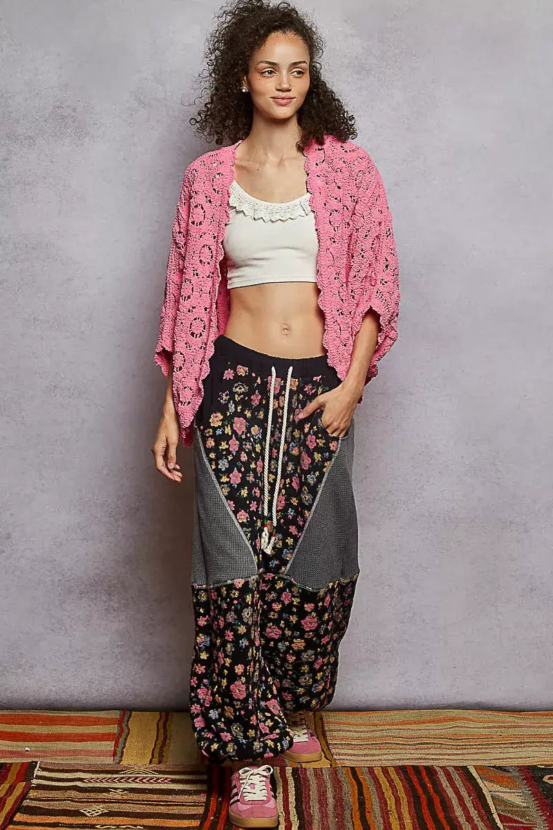 Model wearing POL Floral Pattern Open Front Cardigan with V-Neck over floral patterned pants.