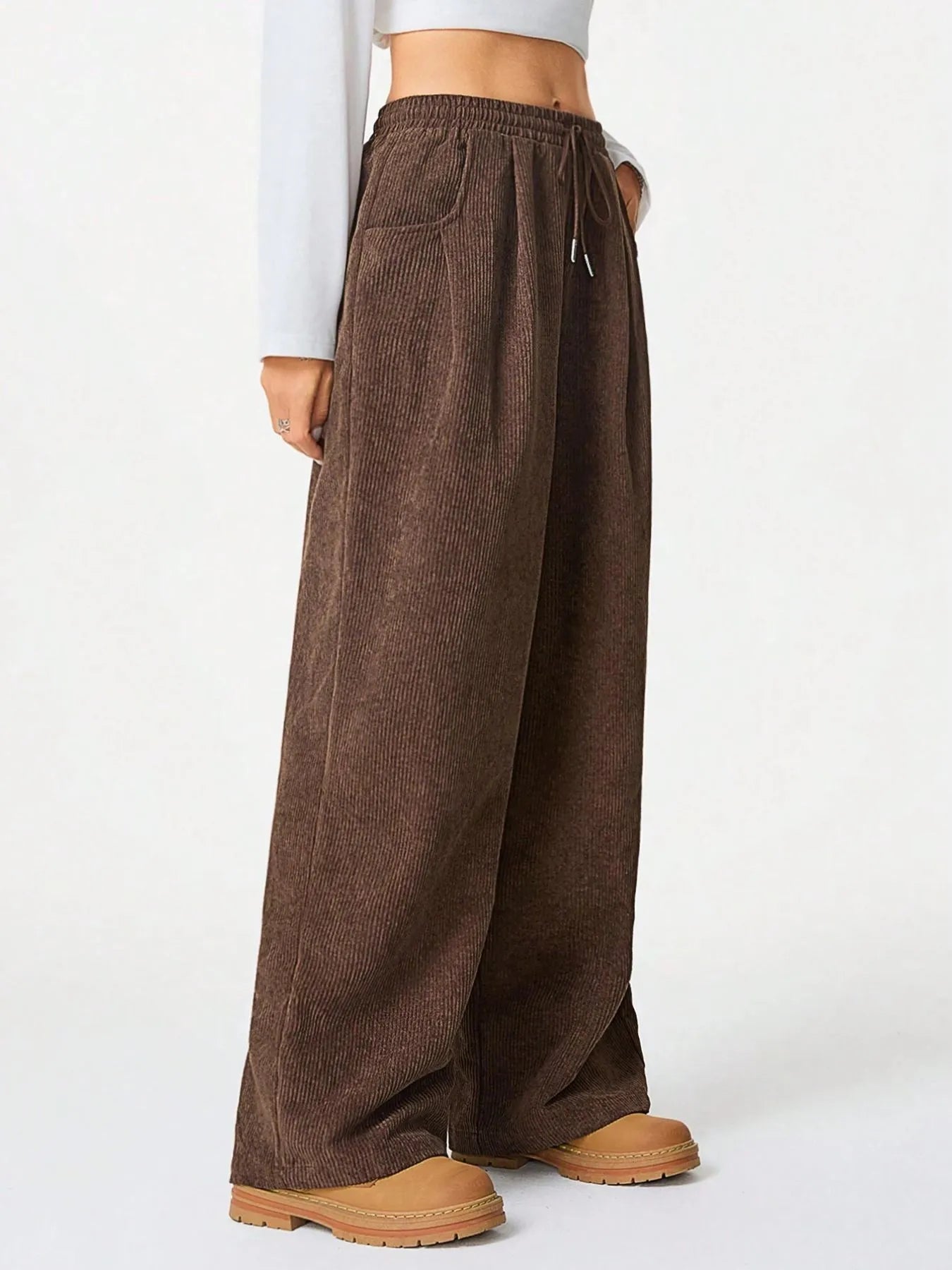 Drawstring Wide Leg Pants in brown for relaxed everyday comfort, featuring pockets and a drawstring waist.