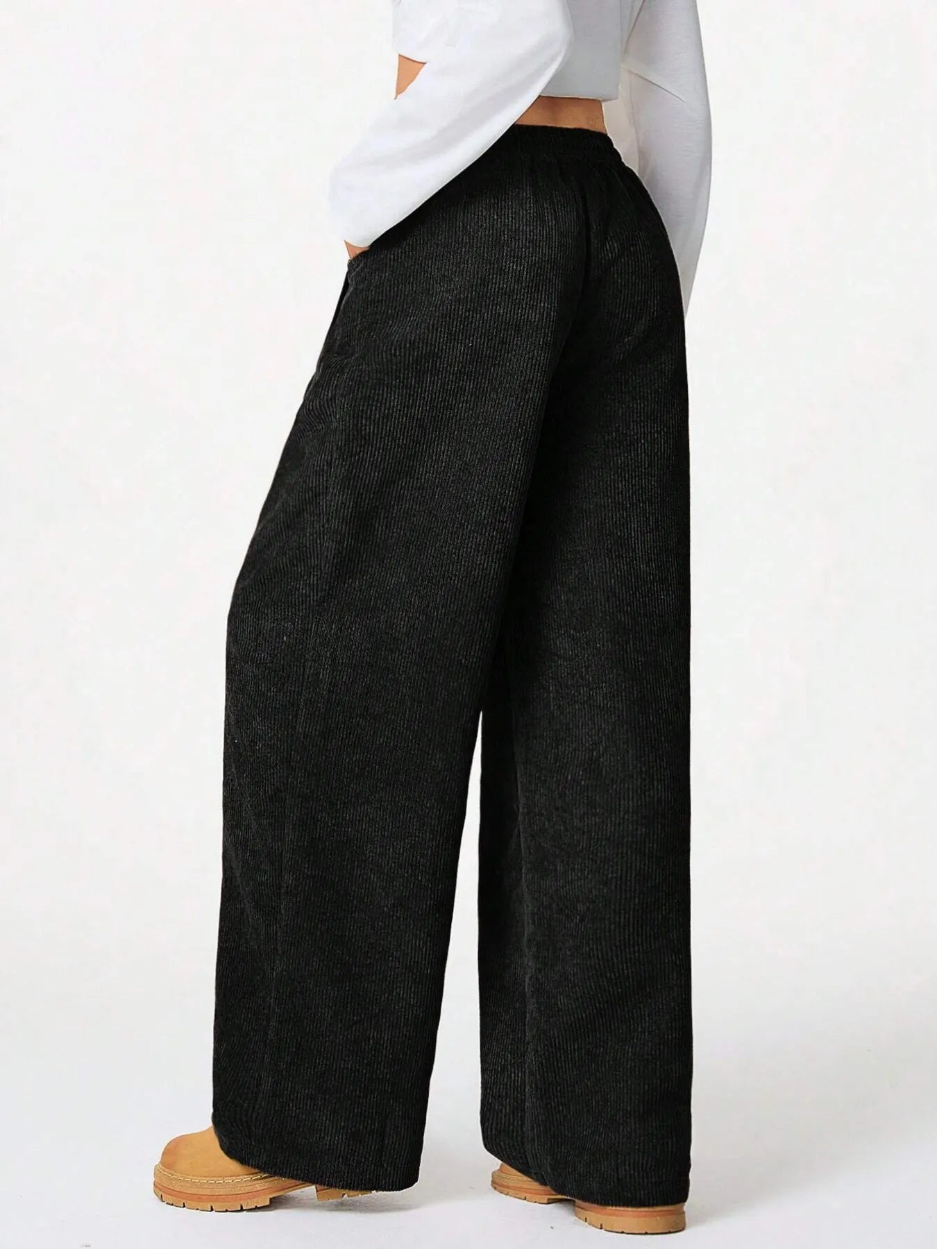 Drawstring Wide Leg Pants offering relaxed everyday comfort, featuring a drawstring and pockets in a stylish black color.