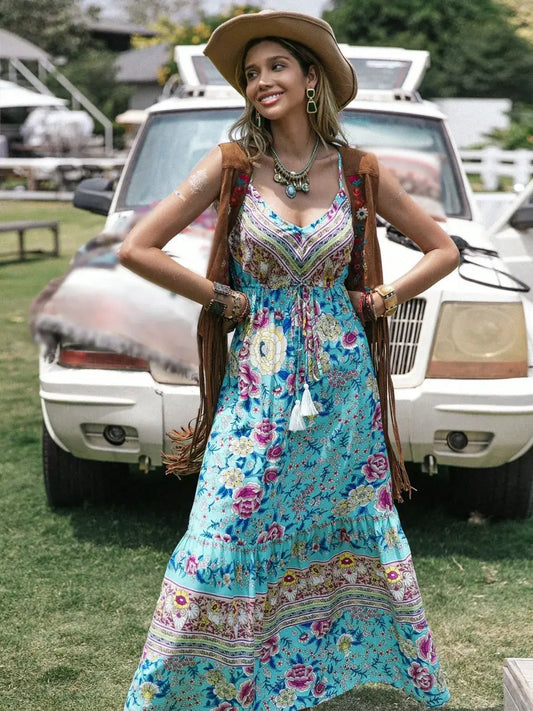 Tassel Floral Print Tiered Cami Dress worn by a model outdoors, showcasing bohemian style with vibrant floral patterns.