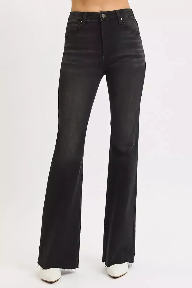 RISEN Plus Size High Rise Flare Jeans with Raw Cut Hem, black denim, modern retro style, comfortable stretch fit.