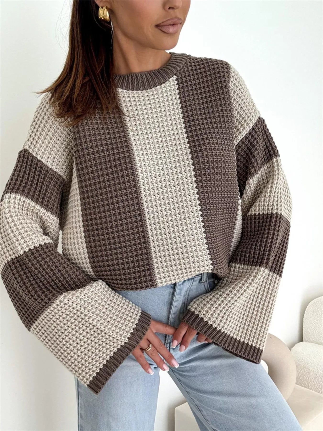 Model wearing Color Block Long Sleeve Sweater in oversized knit style with brown and beige stripes.