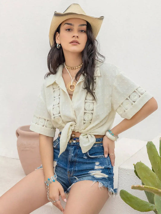 Model wearing a stylish Collared Neck Half Sleeve Shirt with a tie front, paired with denim shorts and a cowboy hat.