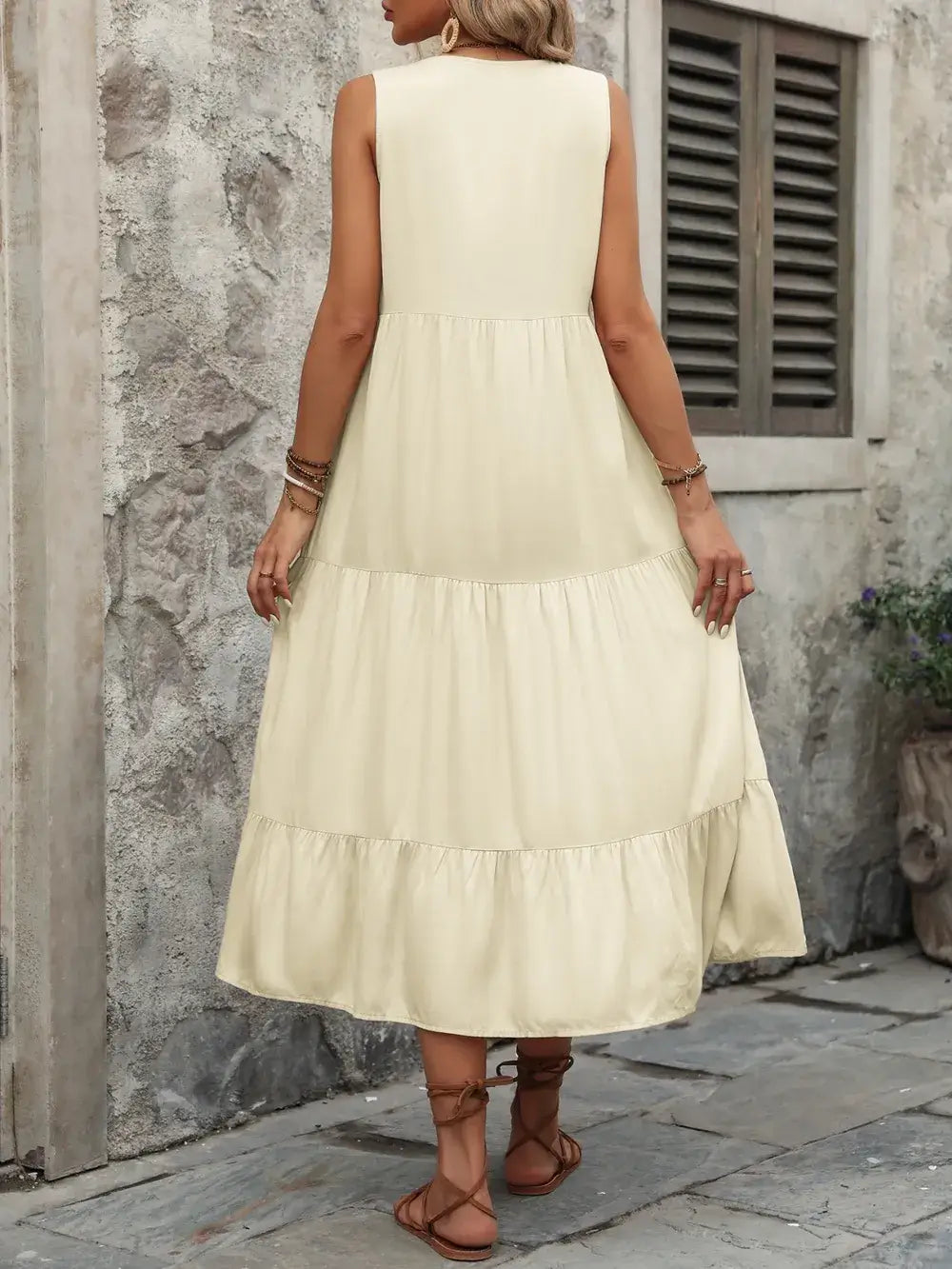 Ivy Lane Decorative Button Notched Sleeveless Dress back view in light yellow, showcasing a tiered design and decorative buttons.