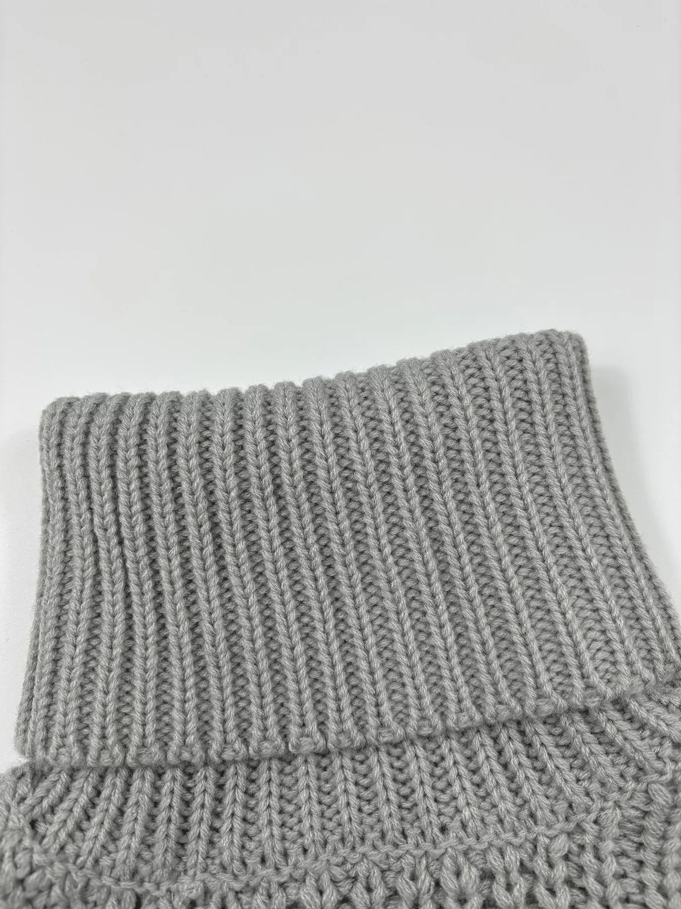 Chunky Knit Turtleneck Long Sleeve Sweater in soft gray fabric close-up of the collar