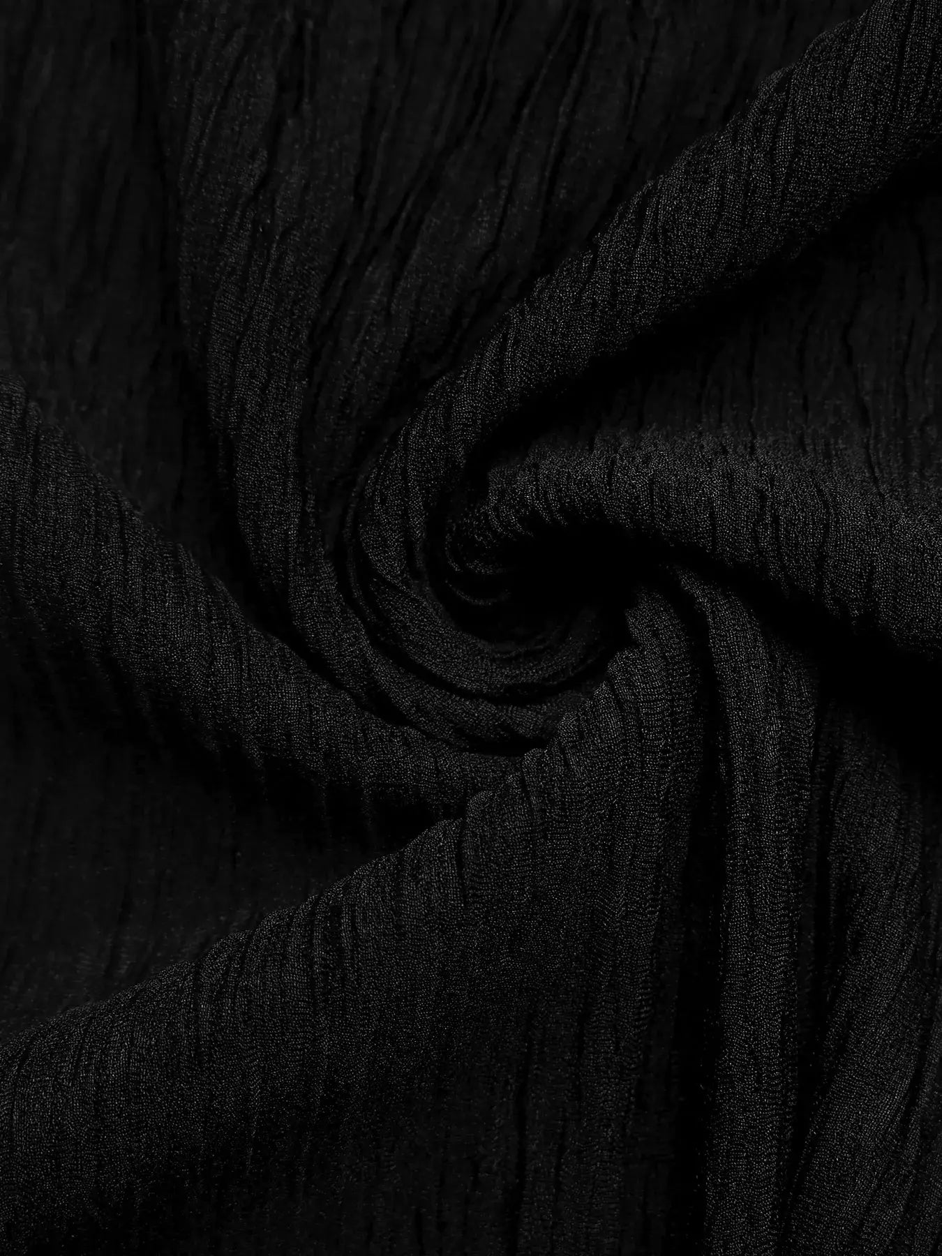 Close-up of textured black fabric for Cold Shoulder Flounce Sleeve Bodysuit.