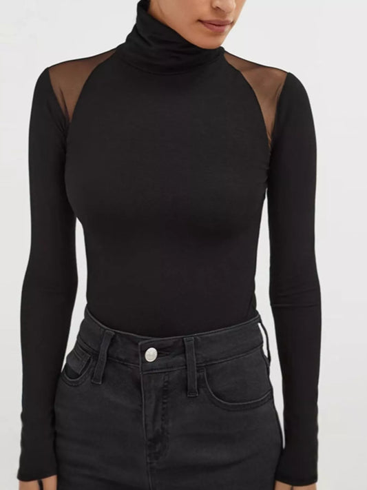 Model wearing a Mesh Shoulder Turtleneck Bodysuit, featuring sheer mesh details and a fitted design.