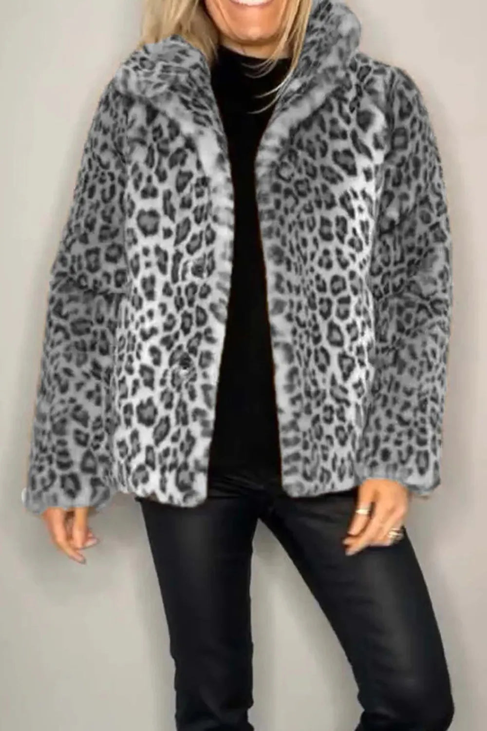 Full Size Leopard Furry Collared Neck Long Sleeve Coat showcased on a model who is smiling and wearing dark pants.