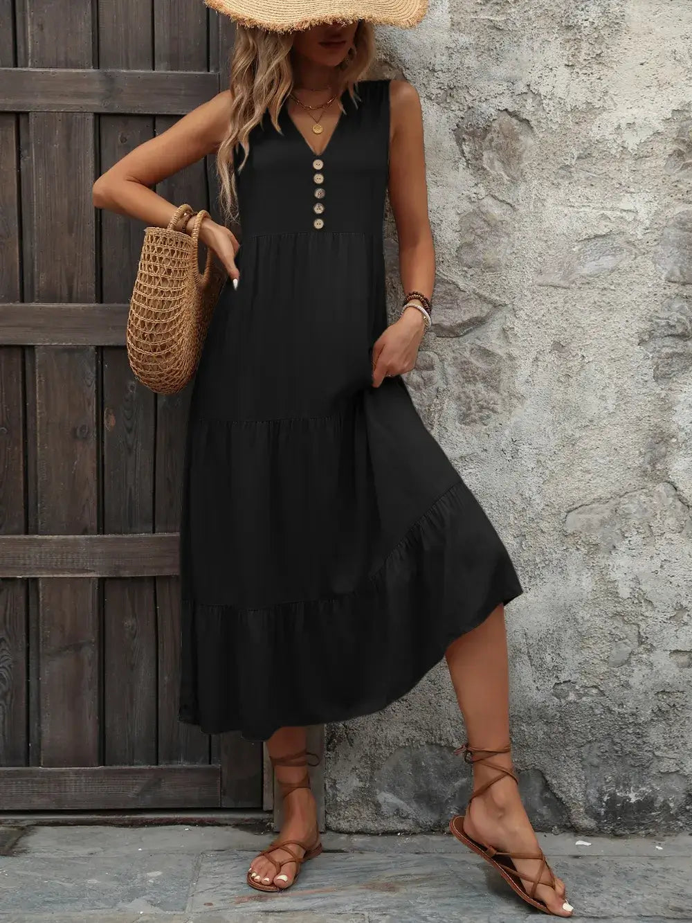 Ivy Lane Decorative Button Notched Sleeveless Dress in black, featuring a notched neckline and decorative buttons.