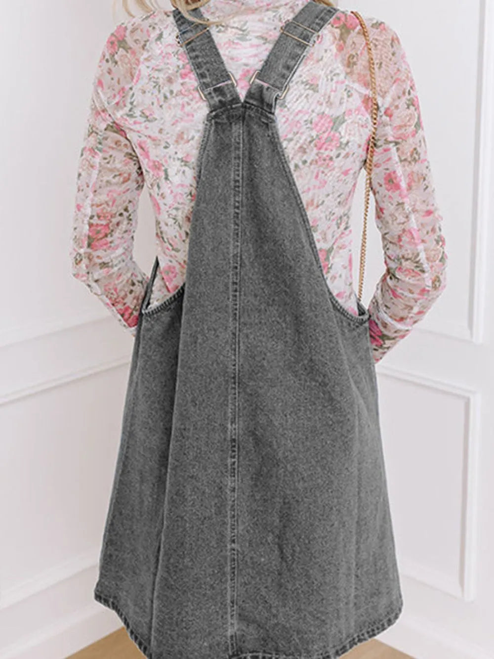 Wide Strap Button Down Denim Overall Dress in dark gray with floral long sleeve top, showcasing casual style.