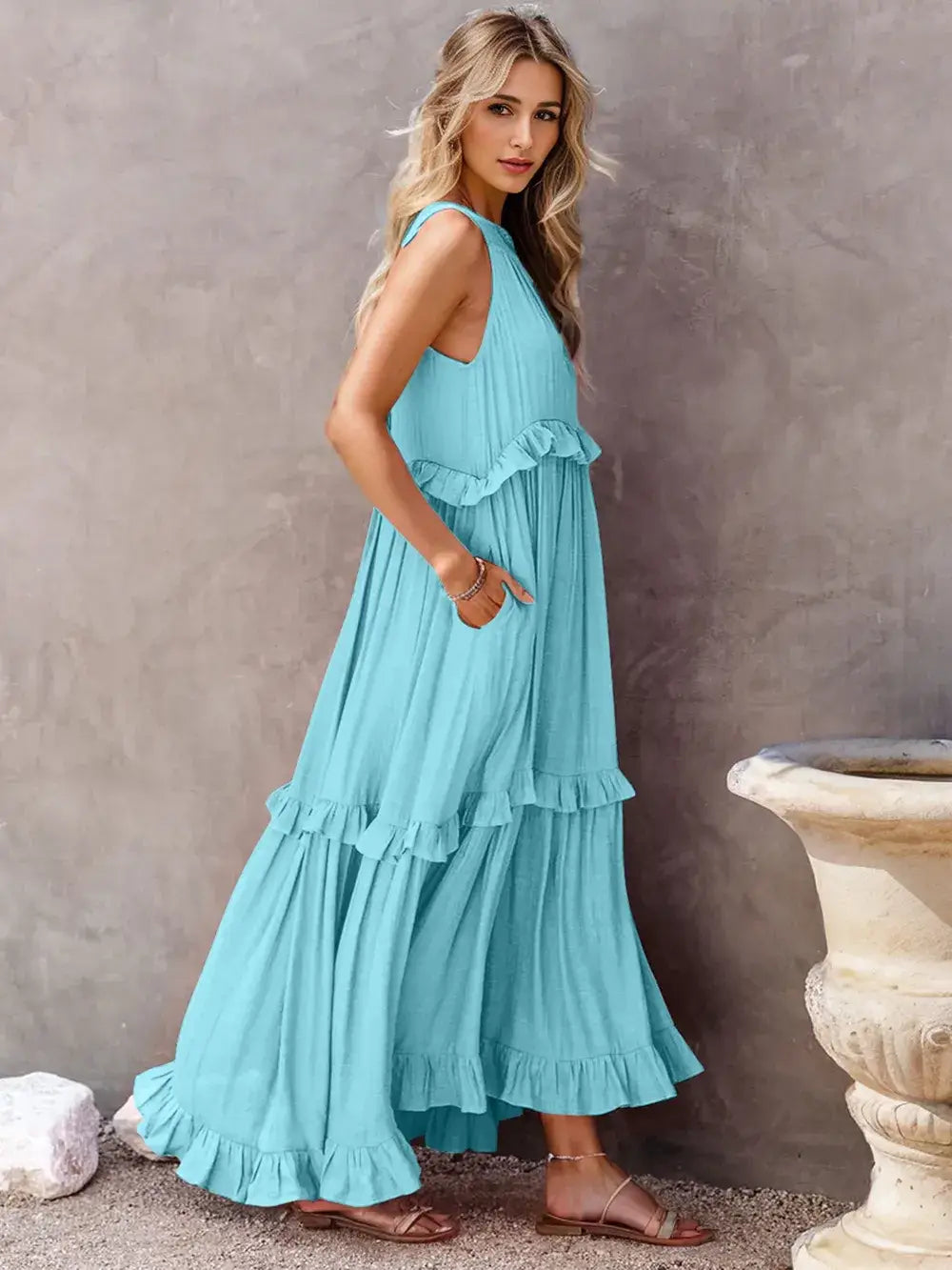 Ruffled Sleeveless Tiered Maxi Dress with Pockets in light blue, showcasing soft ruffles and flowing silhouette.