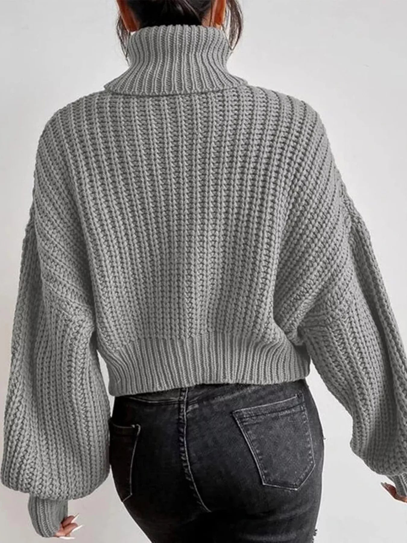 Chunky Knit Turtleneck Long Sleeve Sweater in gray, shown from behind, showcasing a cozy fit and ribbed texture.