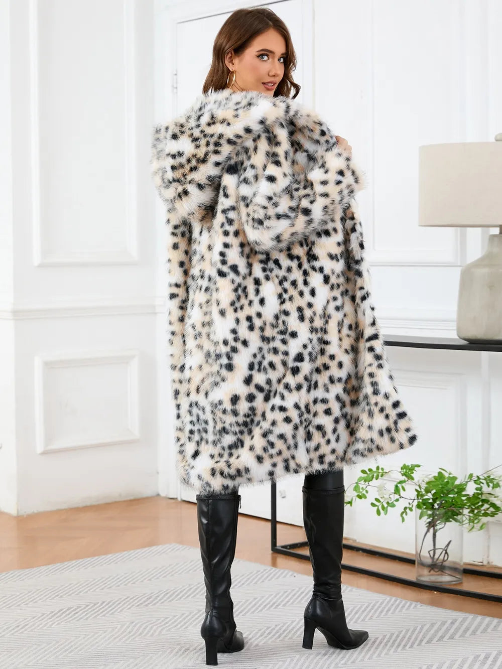 Woman wearing Thermal Leopard Faux Fur Hooded Outerwear with pockets, perfect for cold days, showcasing stylish design.