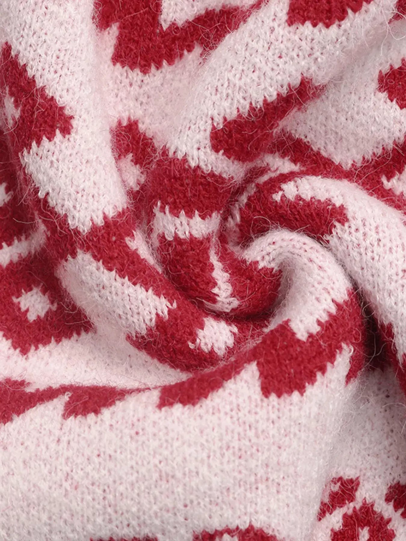 Close-up of festive red and white knit pattern fabric for CHEERS Christmas Round Neck Long Sleeve Sweater.