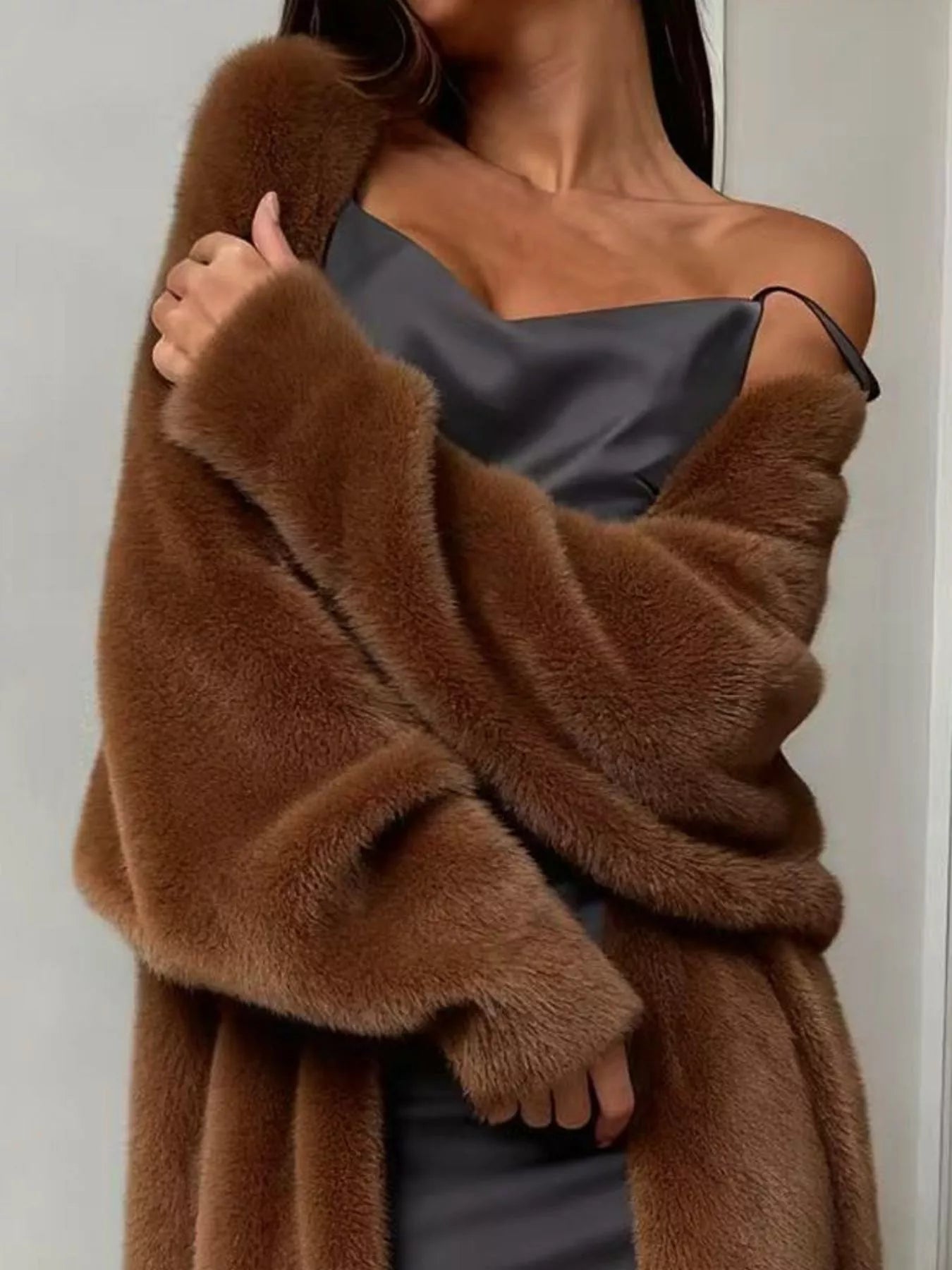 Fuzzy Open Front Longline Cardigan draped over a model wearing a sleek dress, showcasing its cozy texture and style.