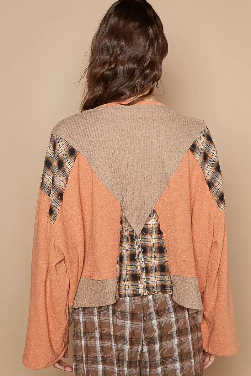 Back view of the POL V-Neck Long Sleeve Plaid Contrast Top featuring texture knit details in warm tones.