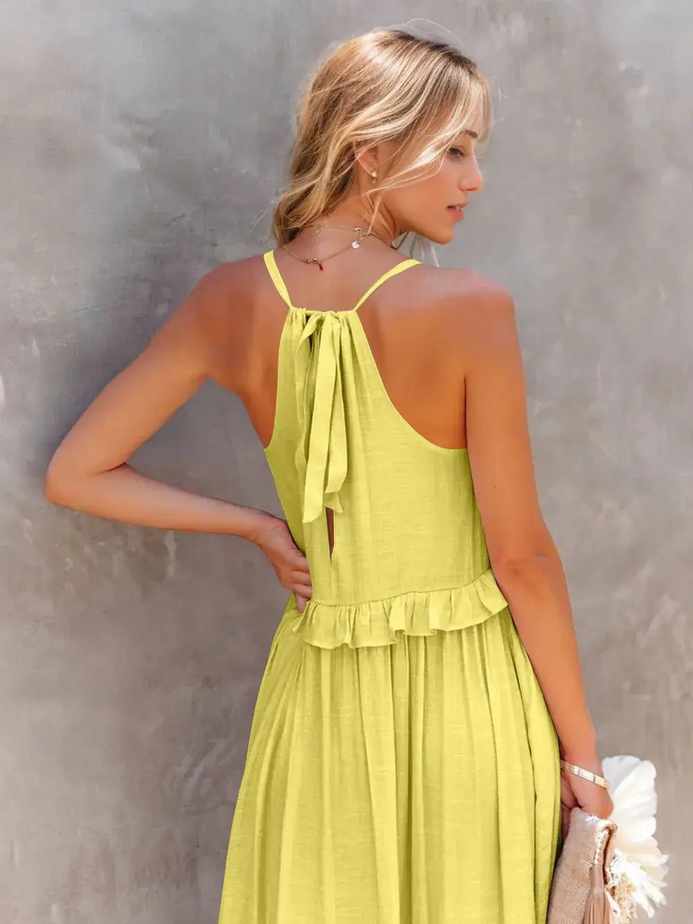 Ruffled Sleeveless Tiered Maxi Dress with Pockets in vibrant yellow, showcasing back detail and ruffled hem.