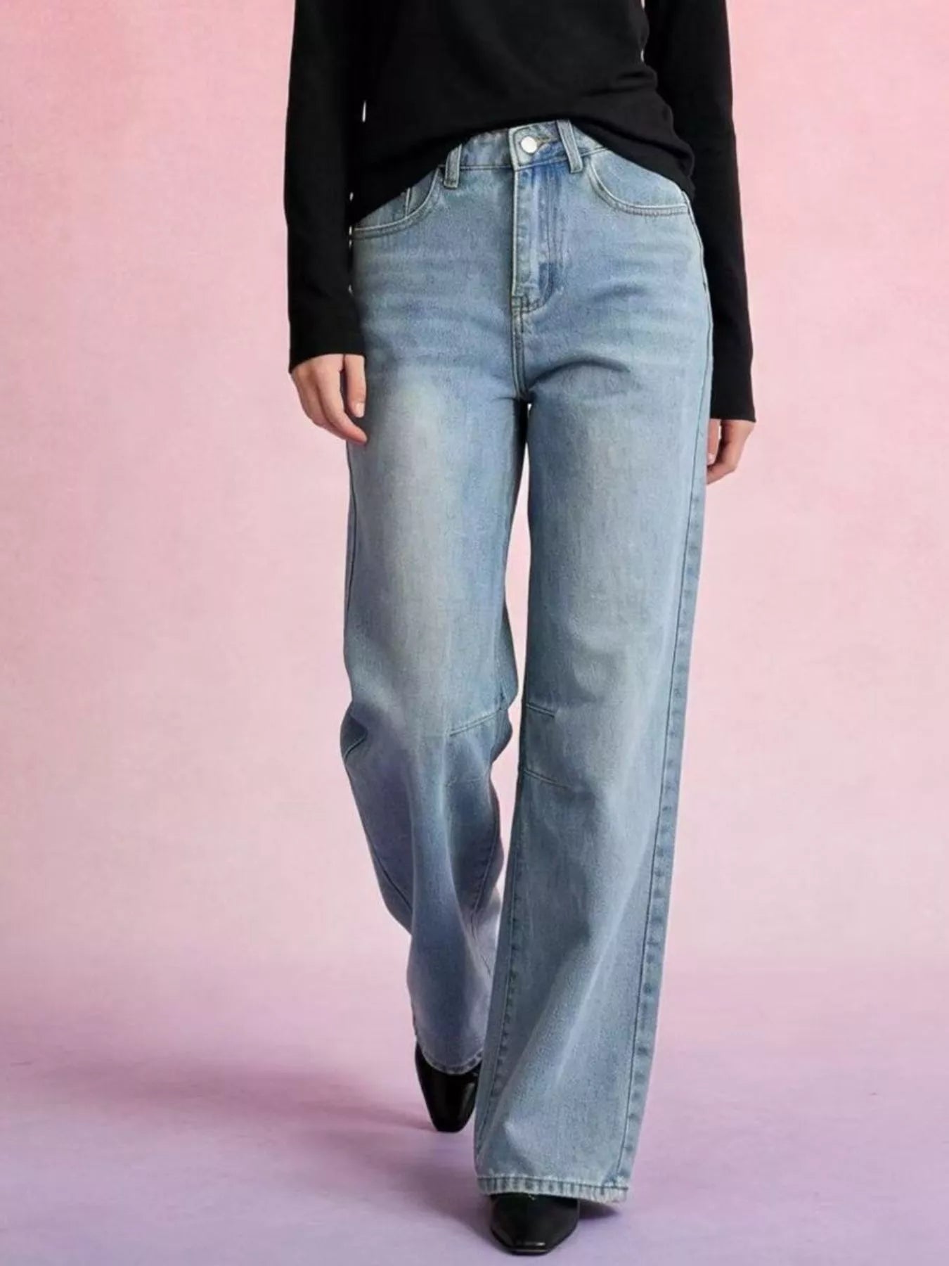 Wide Leg Wash Jeans with Buttoned Pocketed Design featuring a model wearing them against a pink background.