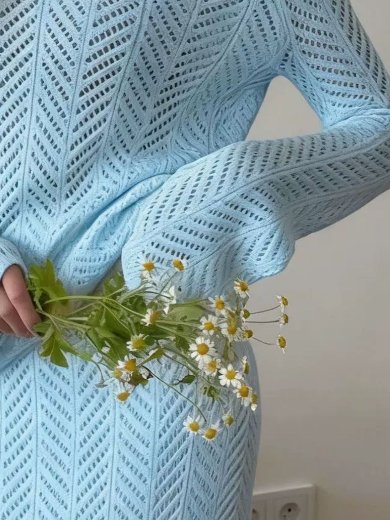 Openwork Long Sleeve Knit Top and Skirt Set in light blue, featuring a textured pattern, styled with flowers in hand.