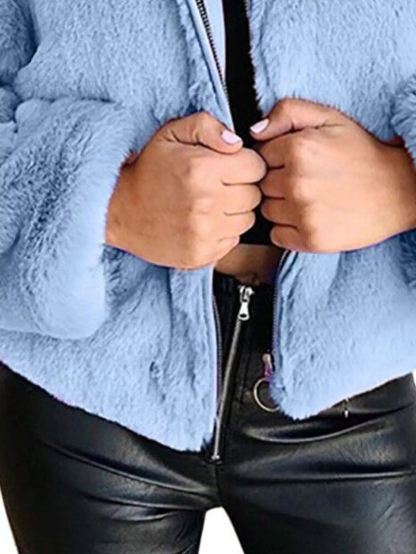 Faux Fur Cropped Zip-Up Jacket in light blue, showcasing oversized style and zipper detail, styled with black pants.