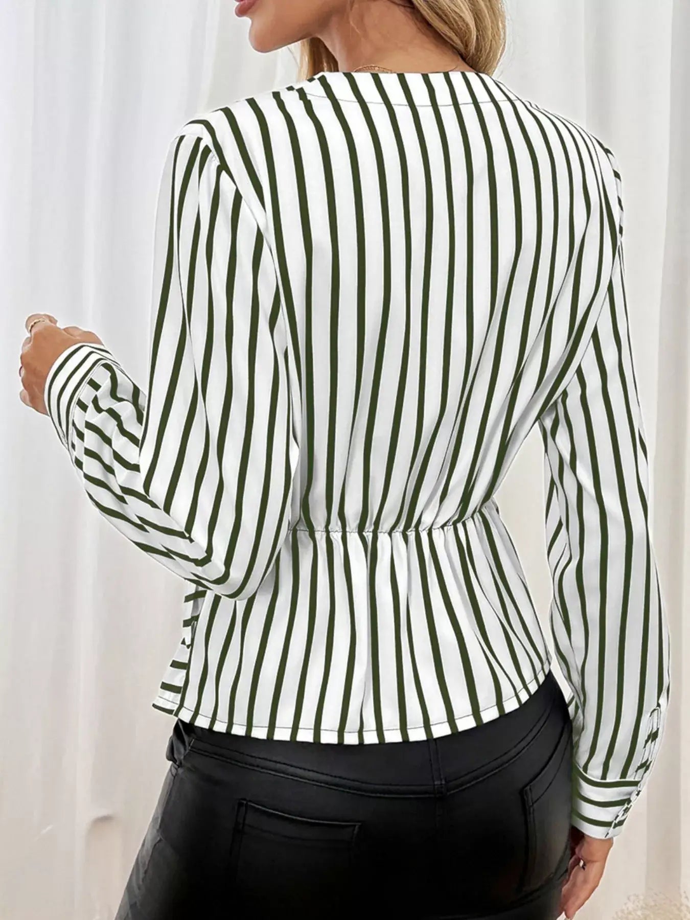 Back view of the Striped Color Block Surplice Shirt showcasing vertical stripes and a gathered waist for a chic look.