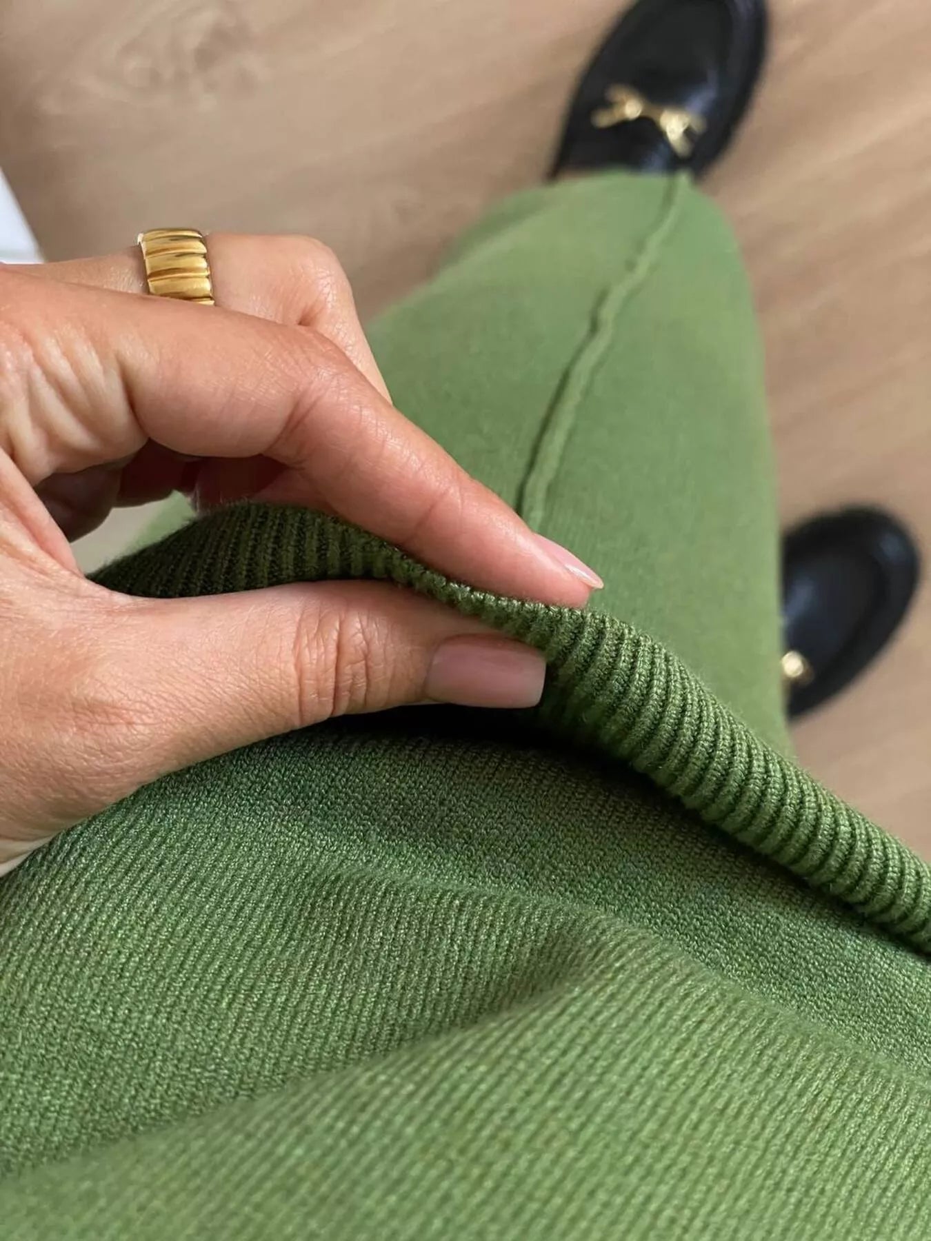 Close-up of the fabric texture of the green pants from the Long Sleeve Top and Pants Sweater Set.