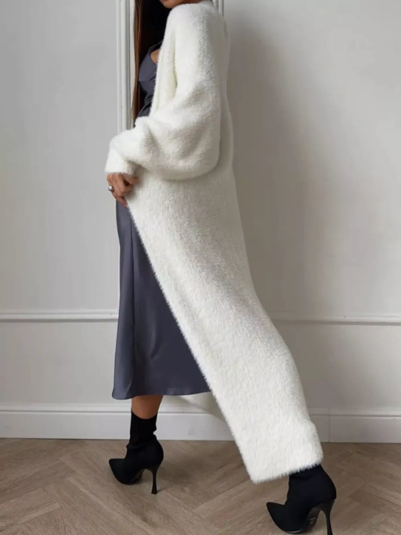 Fuzzy Open Front Longline Cardigan showing a model in a white cardigan paired with a grey dress.