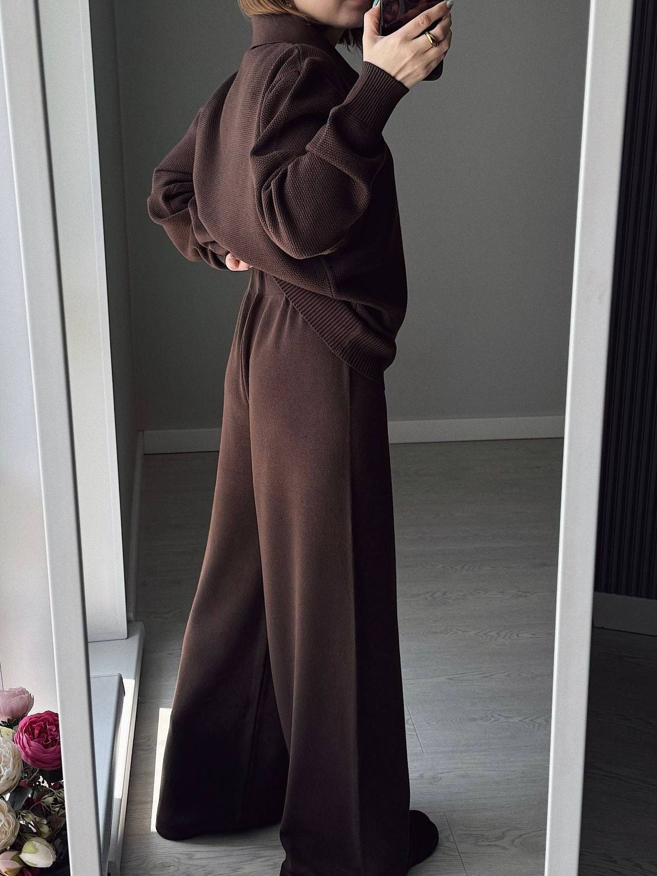 Model wearing a Polo Collar Knit Two Piece Set featuring a buttoned top and wide-leg pants in a rich brown color.