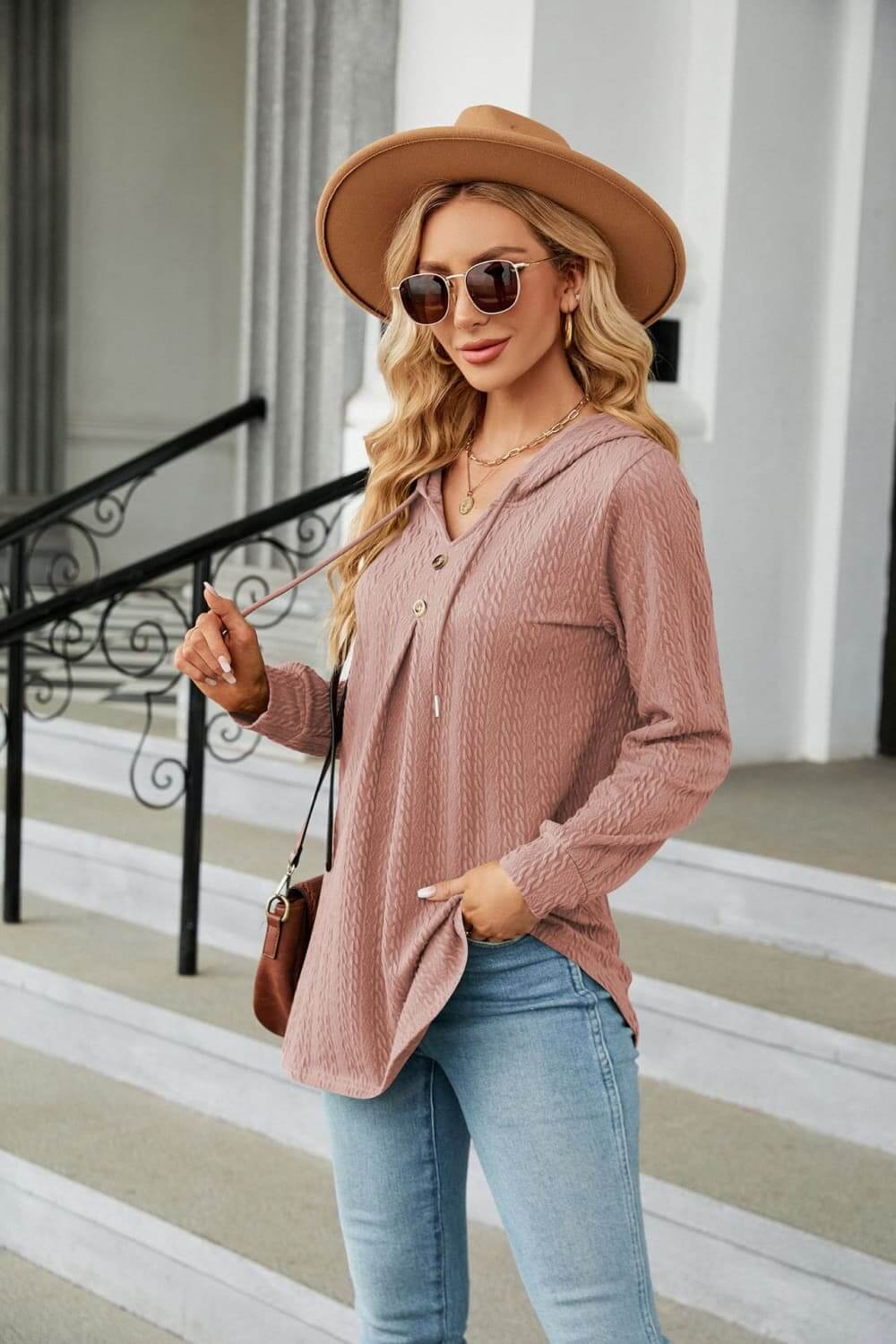 Model wearing Long Sleeve Hooded Blouse with tie-neck design, stylish hat, and sunglasses in a casual setting.