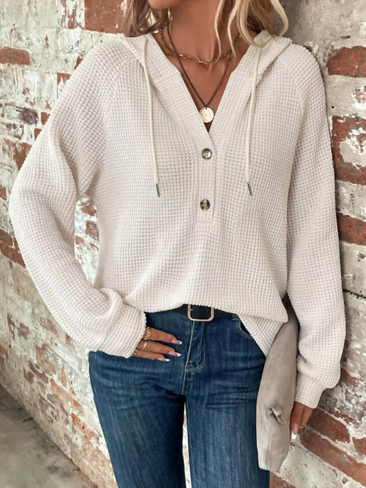 Full Size Button Detail Waffle Knit Hoodie Plus Size styled with denim against a brick wall background.