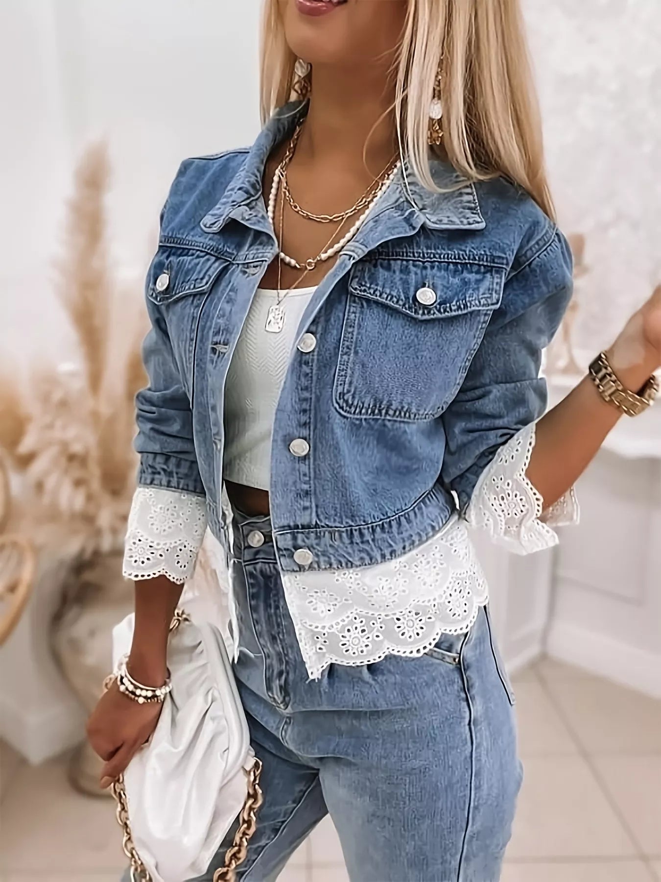 Cropped Denim Jacket with Lace Trim styled for chic casual looks, showcasing lace detail and buttoned pockets.