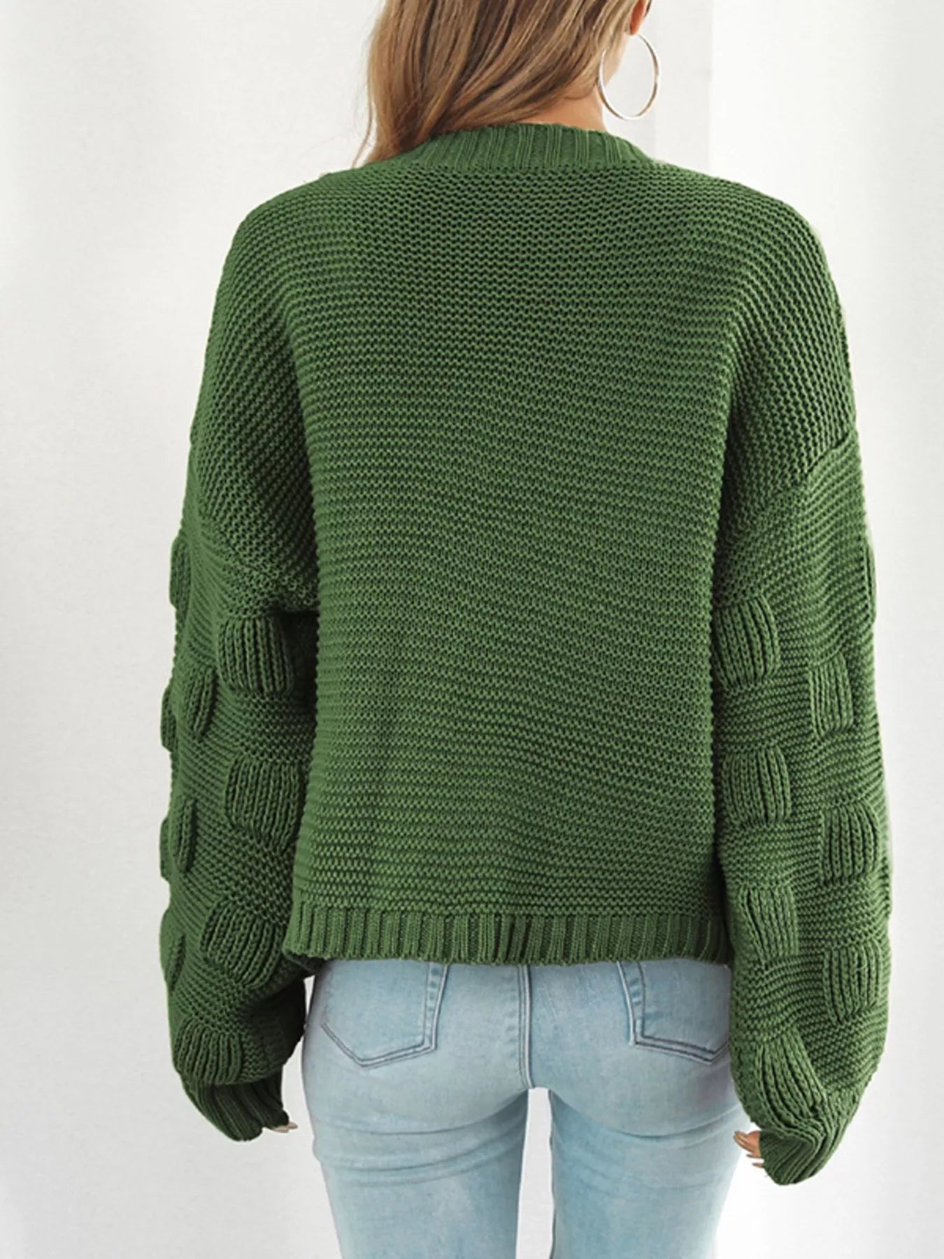Back view of a Chunky Knit Open Front Cardigan in green, showcasing ribbed details and slightly stretchy fabric.