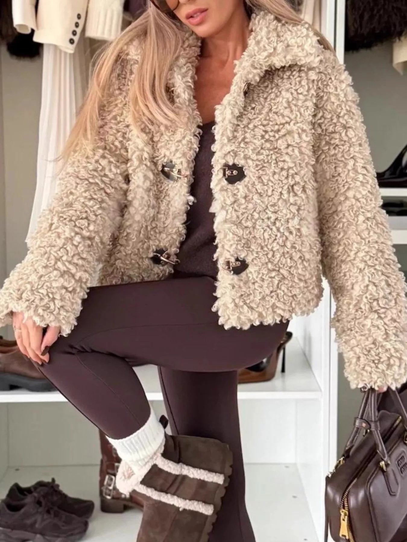 Sherpa Button-Down Outerwear shown on model, featuring a soft, fuzzy texture and buttoned front for cozy everyday layering.