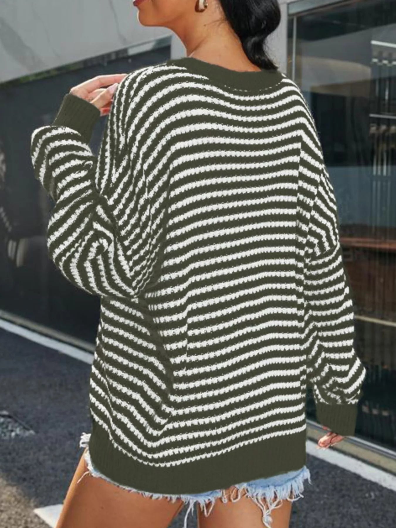 Striped Round Neck Drop Shoulder Sweater – Casual Cozy Knit with white stripes and green background, styled with shorts.