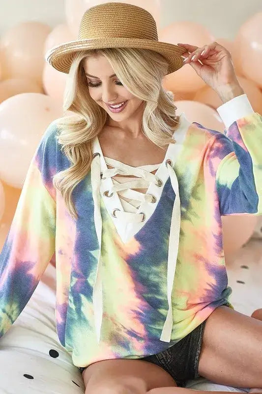 BiBi Tie Dye Deep V-Neck Top with Lace Up Front – Boho Chic worn by a model, featuring colorful tie dye and lace-up detail.