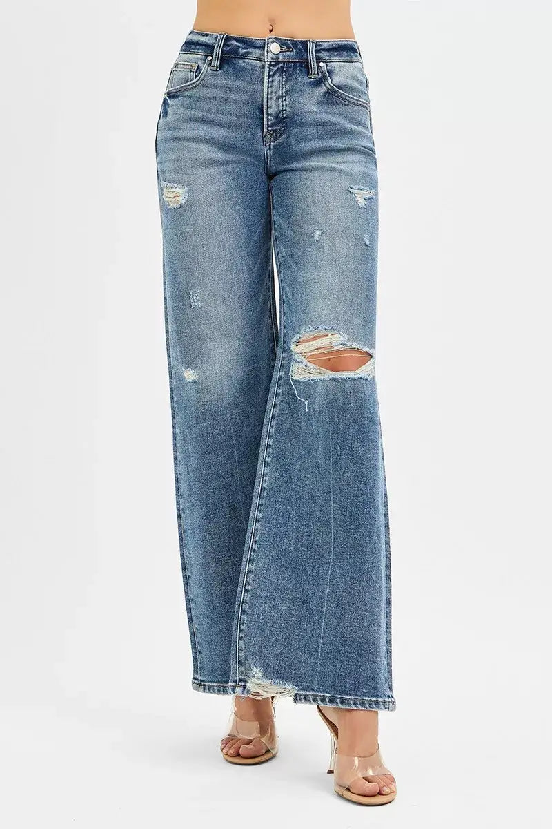 RISEN Tummy Control Mid Rise Fit Wide Jeans with distressed details and raw hem, showcasing stylish wide-leg fit.