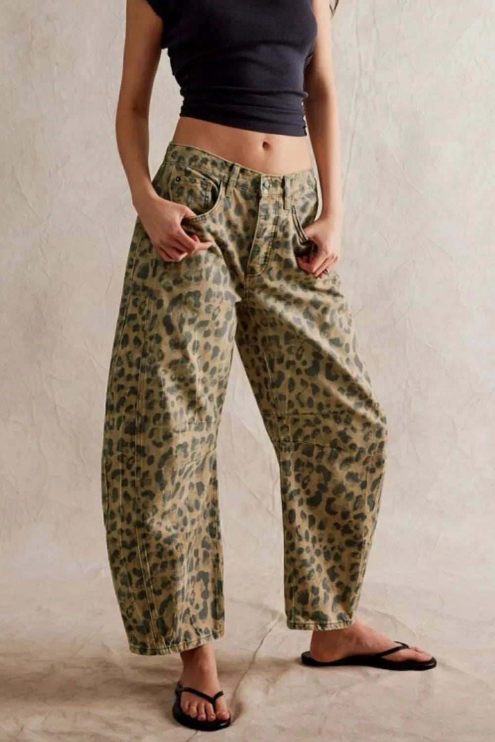 Wide Leg Jeans with Pockets in leopard print, featuring buttoned design and casual style for everyday wear.