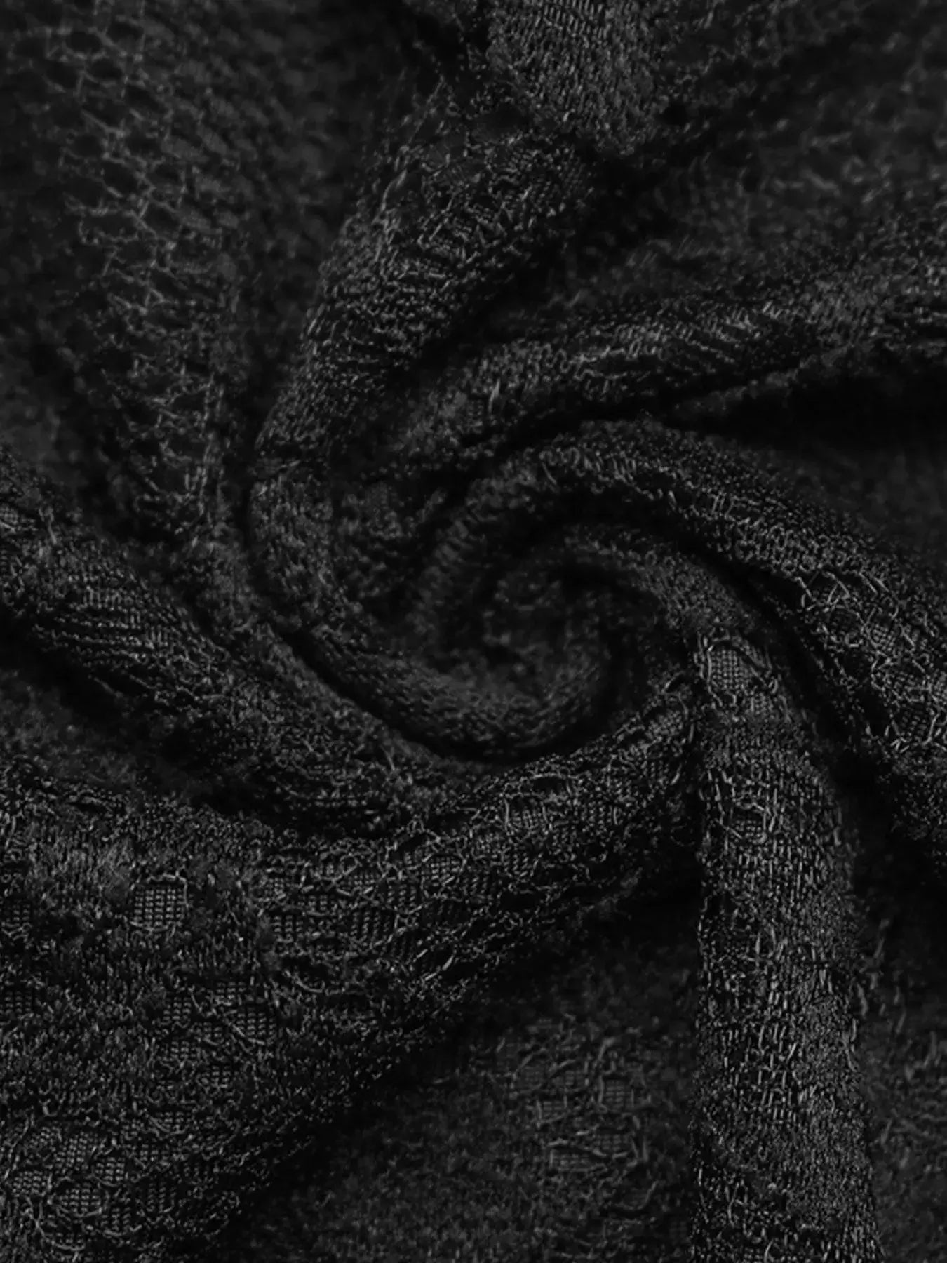 Close-up of the lace fabric used in the lace long sleeve v-neck bodysuit, showcasing its delicate texture and elegance.