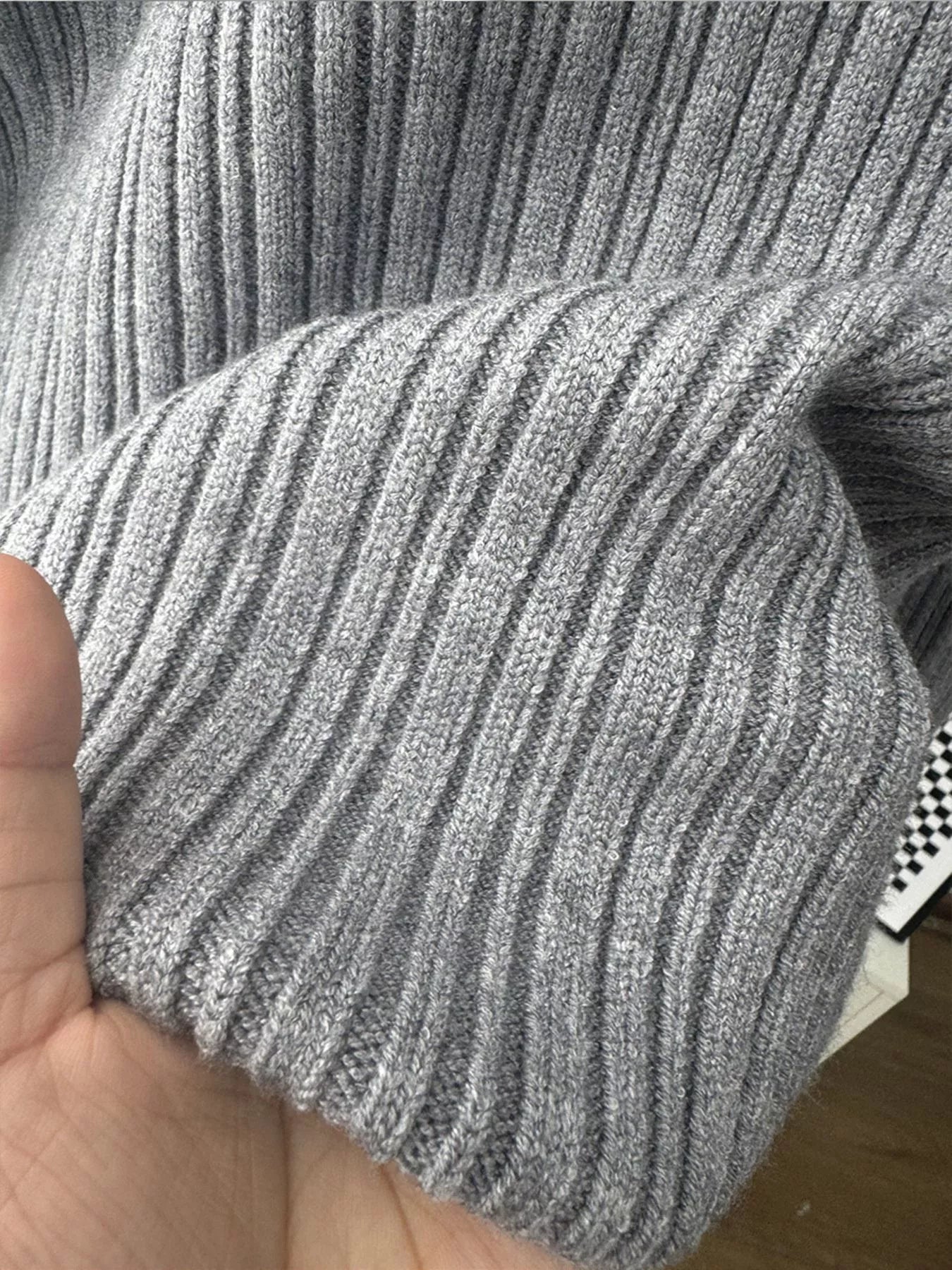 close-up view of the ribbed texture on the 3 Piece Ribbed Sweater and Wide Leg Pants Set's sleeve