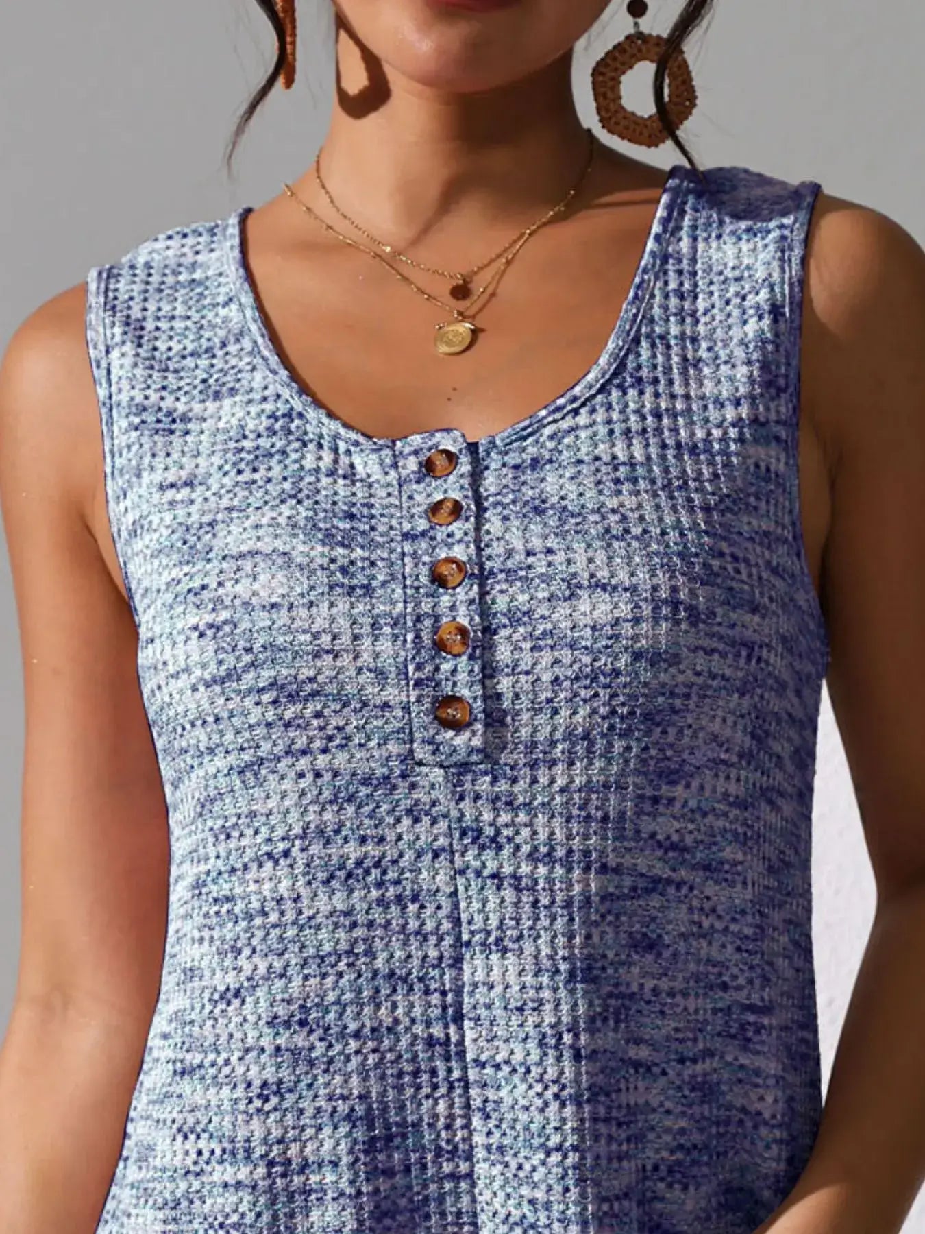 Full Size Button Front Romper with Pockets showcasing button detail and soft fabric for stylish comfort.