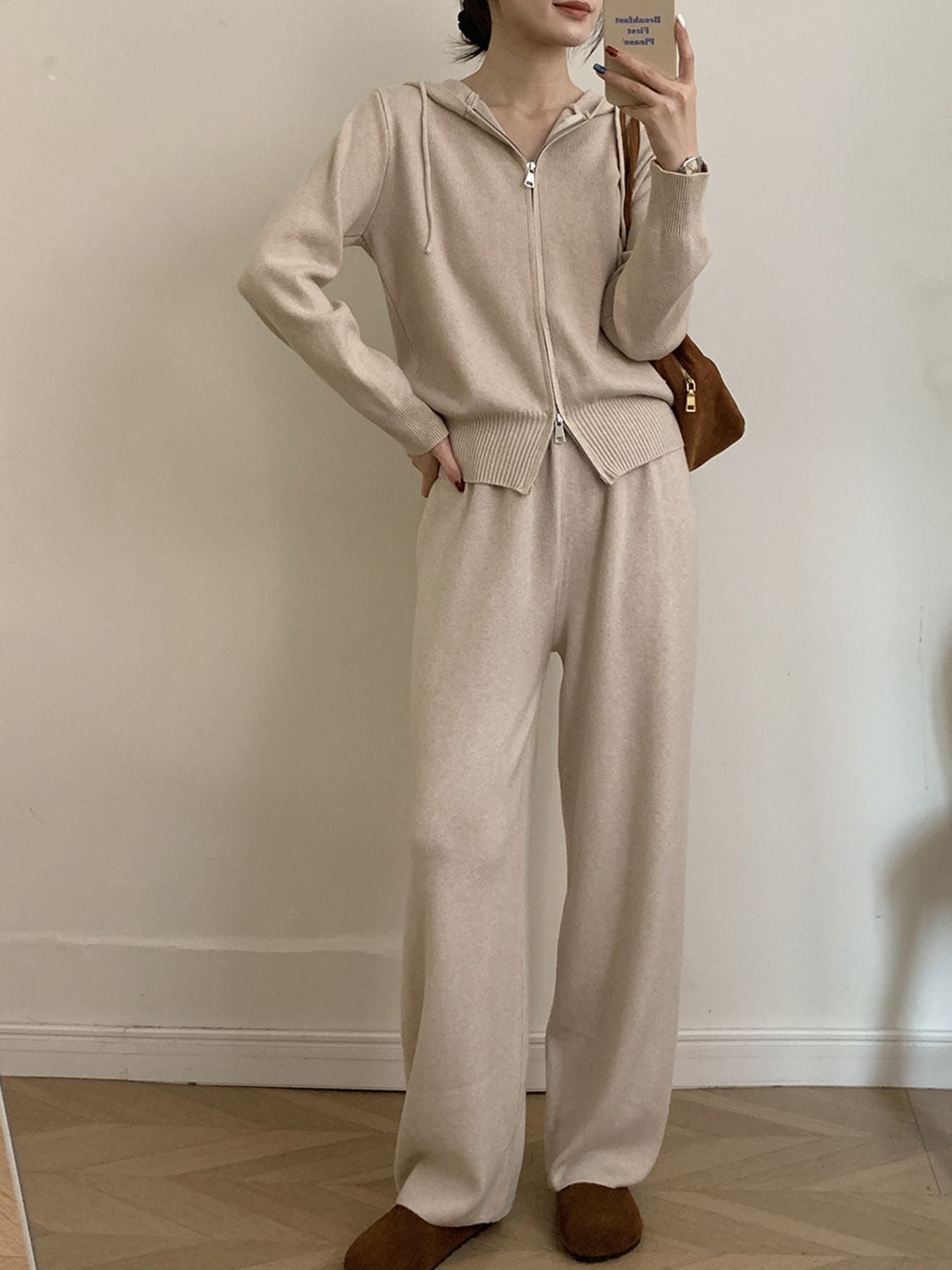 Model wearing Zip Up Cardigan and Wide Leg Pants Knit Set in beige, showcasing stylish two-piece outfit.