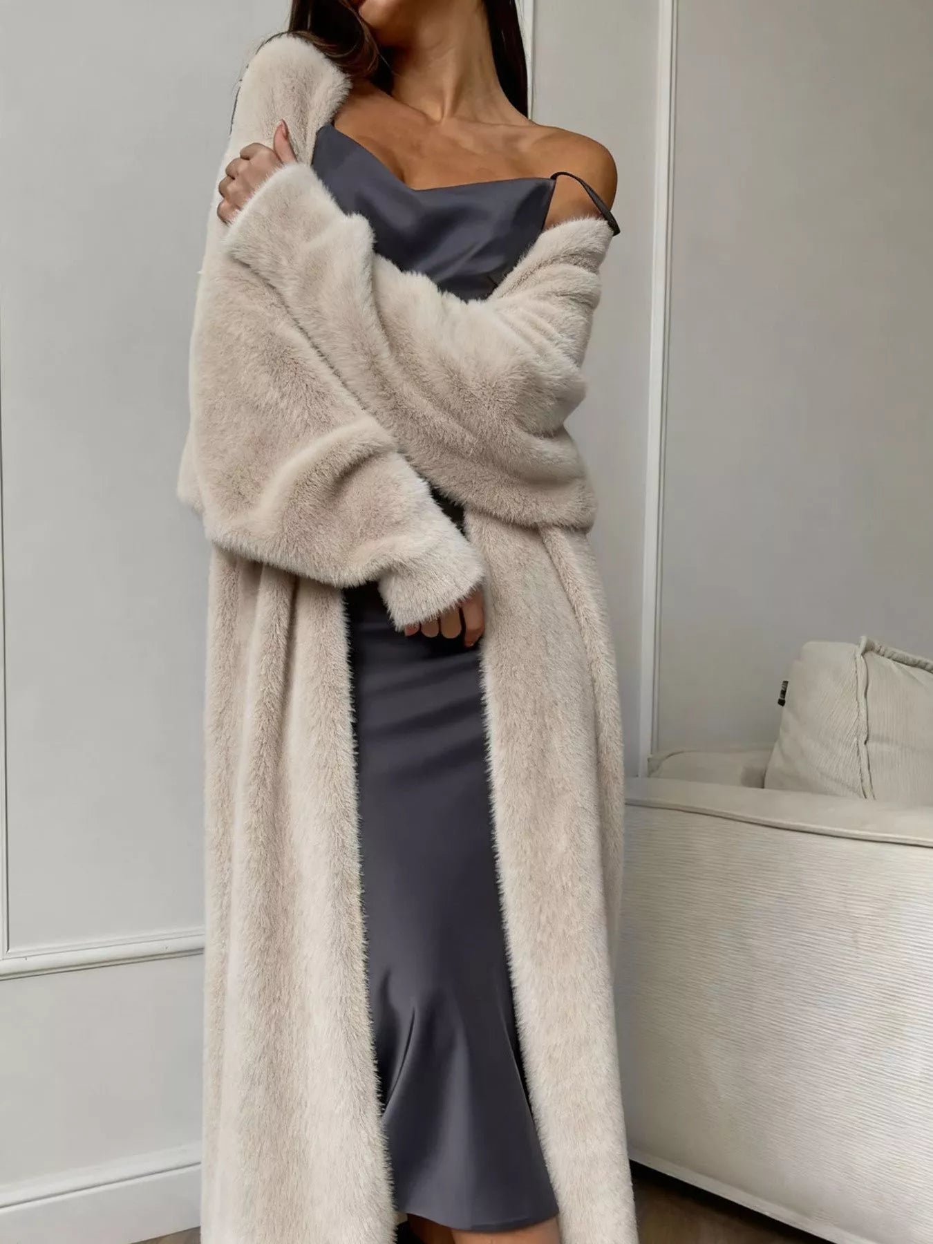 Model wearing a Fuzzy Open Front Longline Cardigan over a sleek dress, showcasing cozy layered style.
