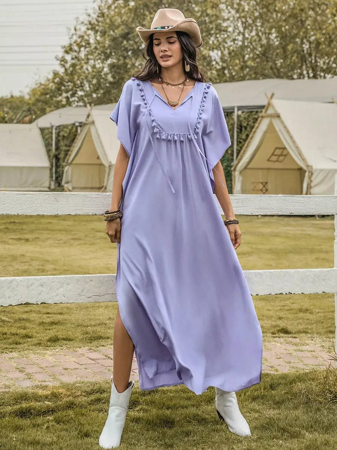 Side Slit Tie Neck Flutter Sleeve Dress in lavender worn outdoors with a hat