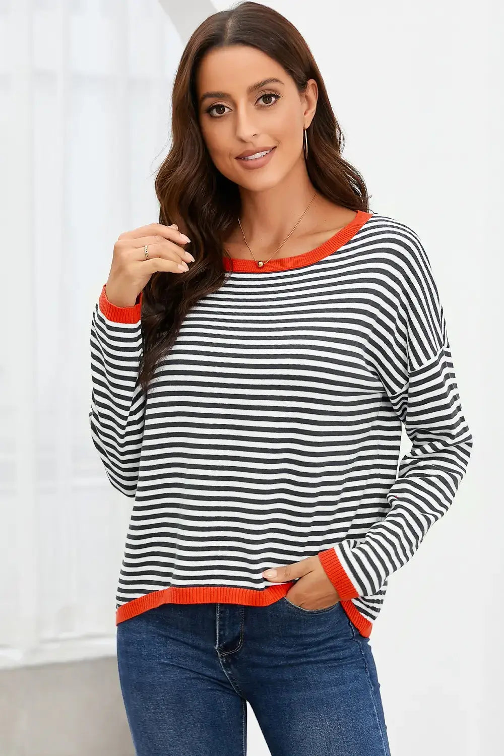 Woman wearing a Striped Round Neck Drop Shoulder T-Shirt with horizontal stripes and a relaxed fit.