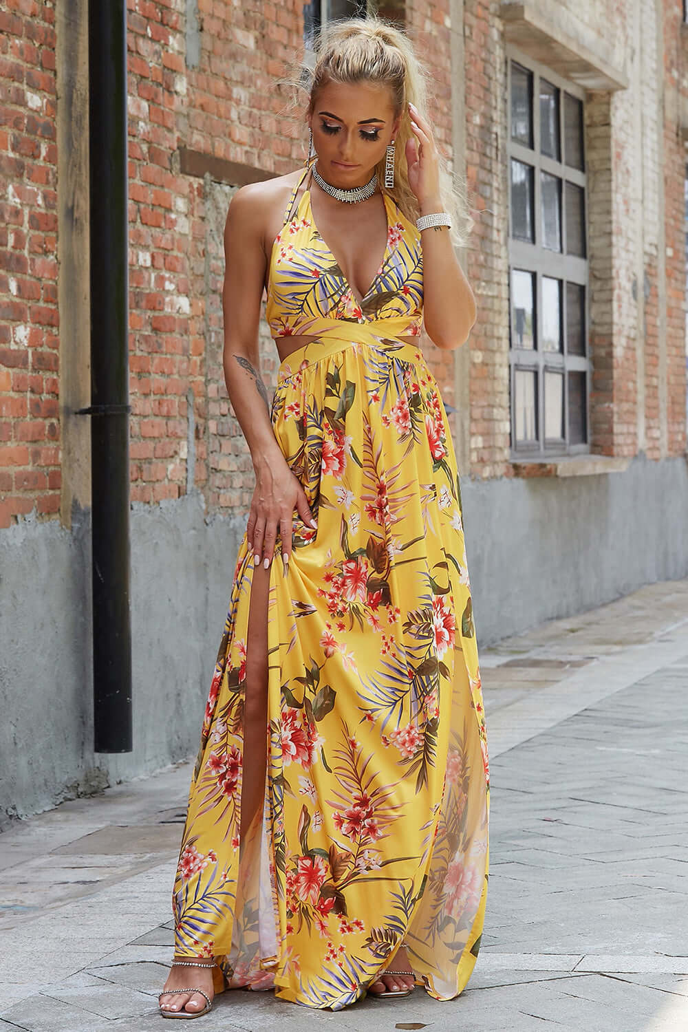 Halter Neck Split Dress in yellow floral print, featuring a chic design and front slit, perfect for elegant evening events.